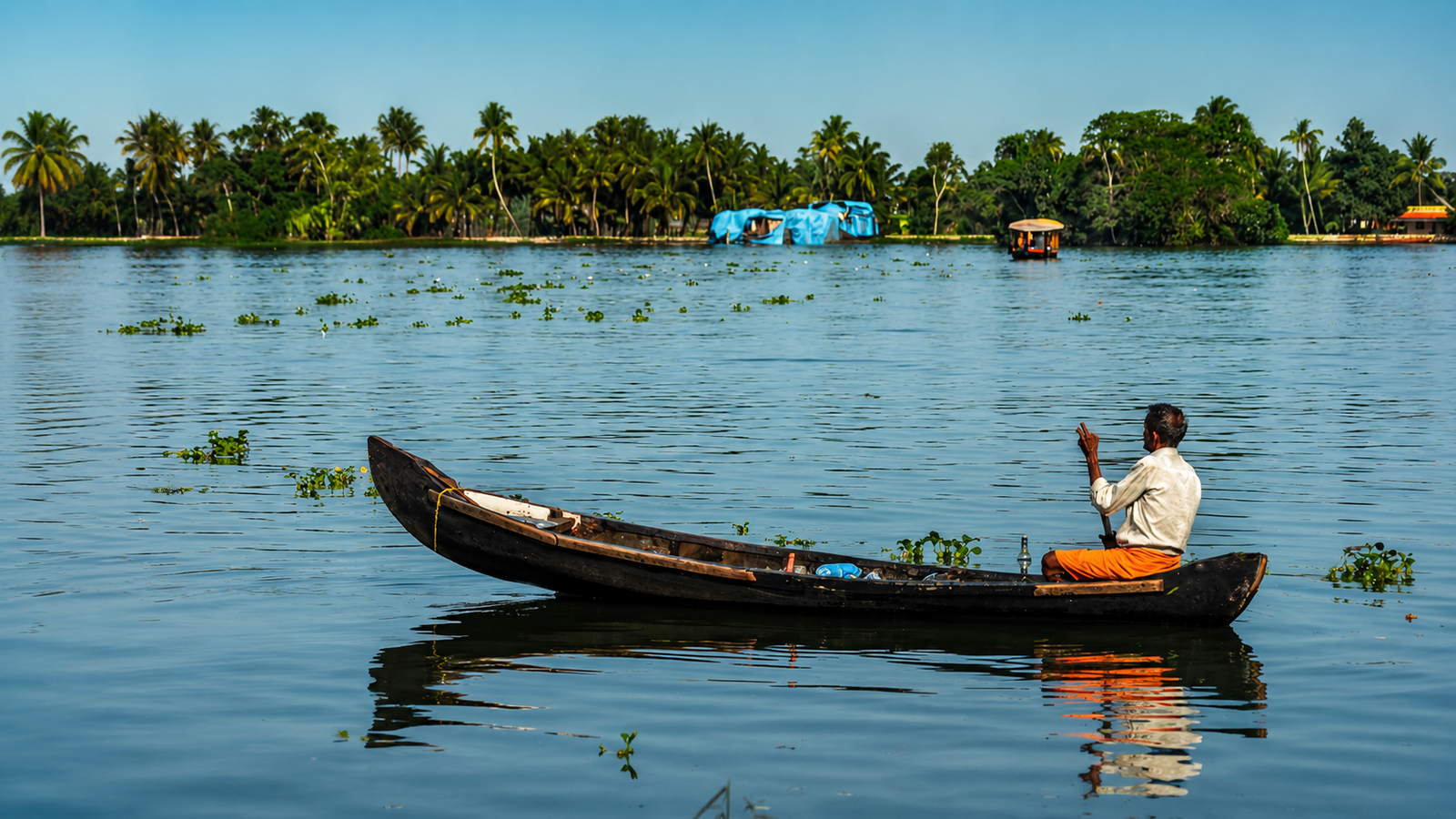 Canoe ride through Munroe Island backwaters.