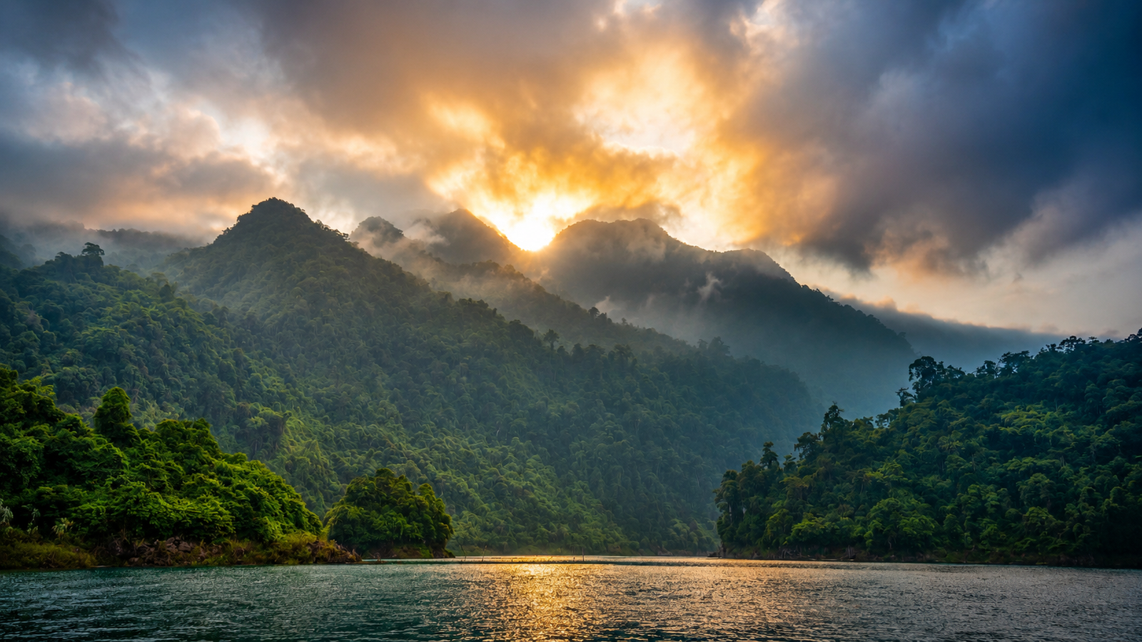 Beautiful sunrise at Gavi Lake surrounded by dense green forests.